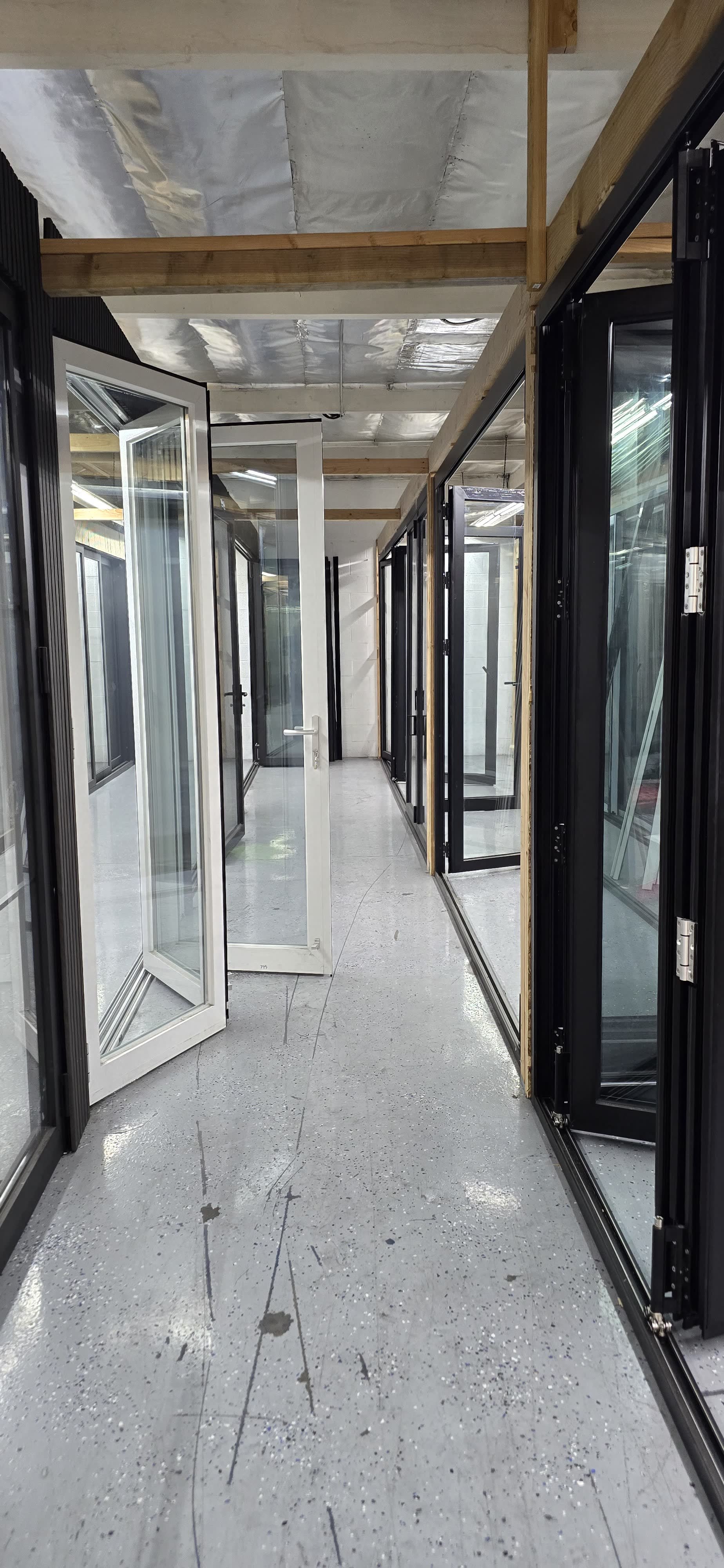 Aluminum door and window units displayed in our fabrication facility