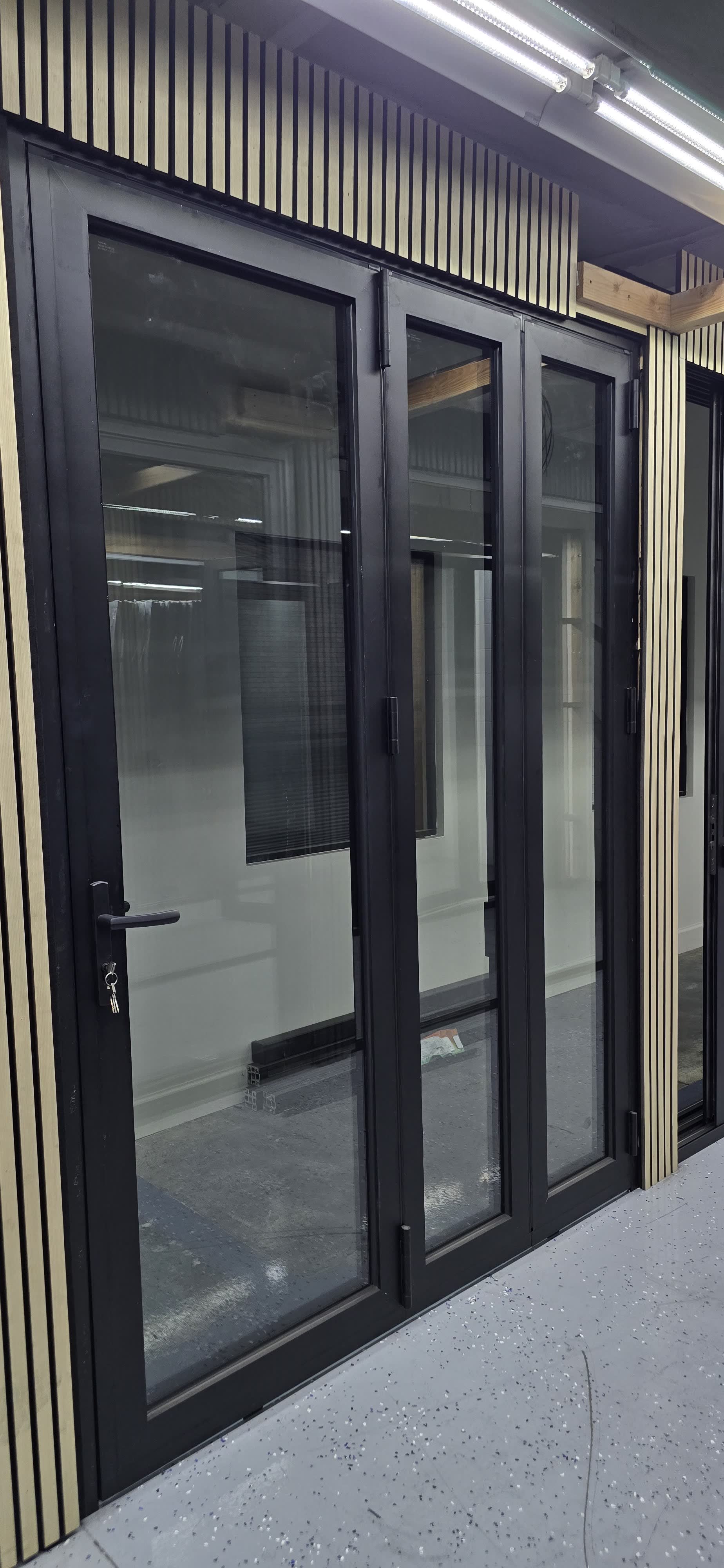 Black aluminum French doors with slim sightlines